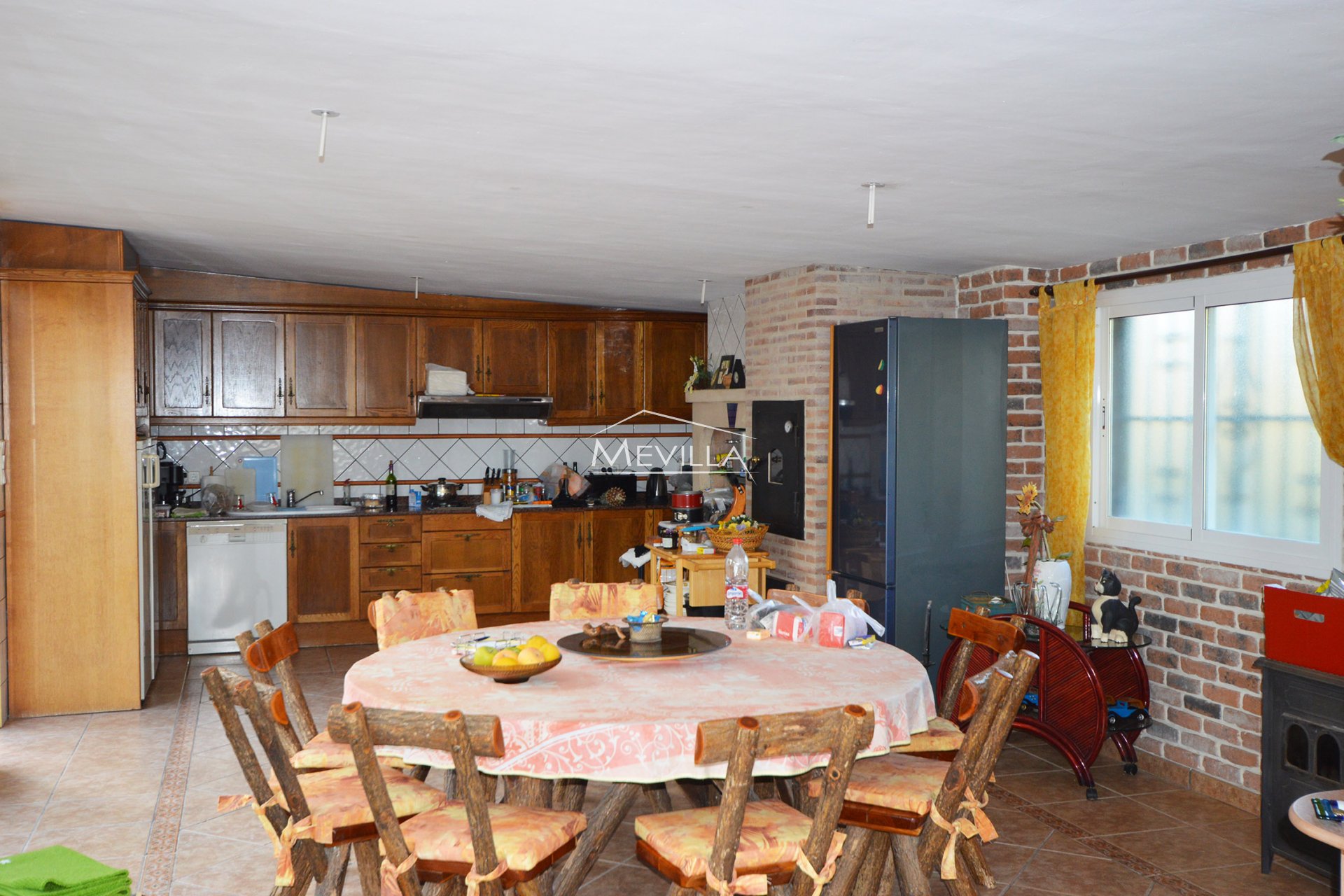 The living room with dining area